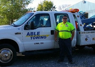Professional with Able Towing Truck